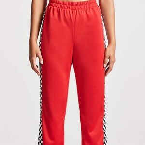 Red pants with checkered panel on sides